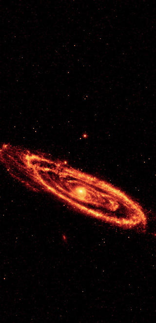 GL�DEST�V: Dette WISE-bildet viser st�v som gl�der i infrar�dt i spiralarmene i Andromeda-galaksen. Foto: NASA/JPL-Caltech/UCLA