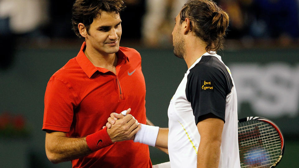 ROTET BORT TRE MATCHBALLER: Roger Federer hadde tre matchballer i tredjerundekampen mot Marcos Baghdatis i Indian Wells, men rotet dem bort alle sammen. I stedet kom kyprioten tilbake og slo sveitseren for f�rste gang i karrieren.Foto: SCANPIX/Matthew Stockman/Getty Images/AFP
