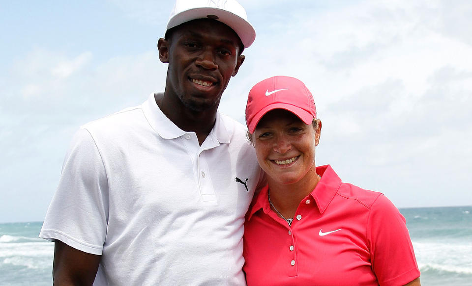 MESTERM�TE: Sprintkongen Usain Bolt stilte opp med Suzann Pettersen p� Jamaica. Foto: Kevin C. Cox/Getty Images/AFP