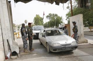 epa02151339 Iraqi policemen stand at a checkpoint in central Baghdad, Iraq on 10 May 2010. Iraqi security forces raised the level of security alert to maximum after several attacks across of Iraq, killing 60 people and wounding 225 others among them Iraqi policemen  EPA/MOHAMMED JALIL
