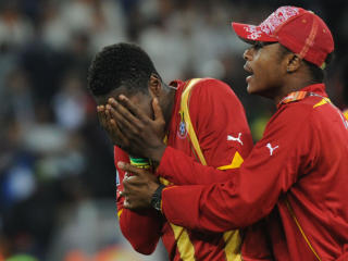 EMOSJONELL: Asamoah Gyan var utr�stelig etter Ghanas VM-exit. Foto: Gabriel Boyus / AFP.