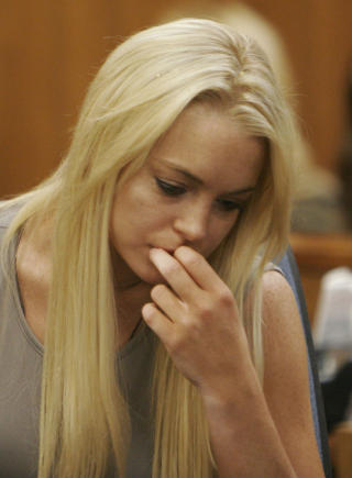 BAK L�S OG SL�: I dag startet Lohan sin soning. Foto:POOL/Al Seib