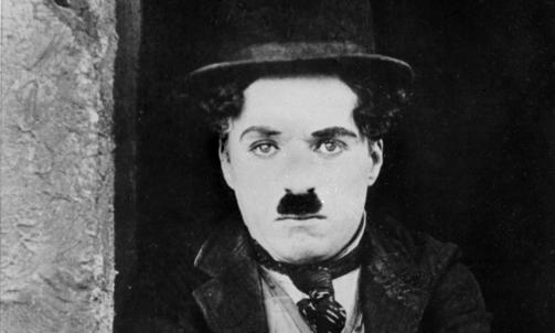 LEGENDE: Charlie Chaplin er mest kjent for sin rolle i filmen the Kid. Foto:  AFP PHOTO