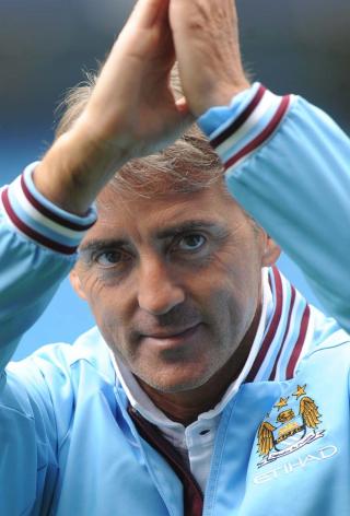 UNDER STORT PRESS: Roberto Mancini m� minst levere enn topp fire-plassering denne sesongen. Foto: EPA/NICK WILKINSON