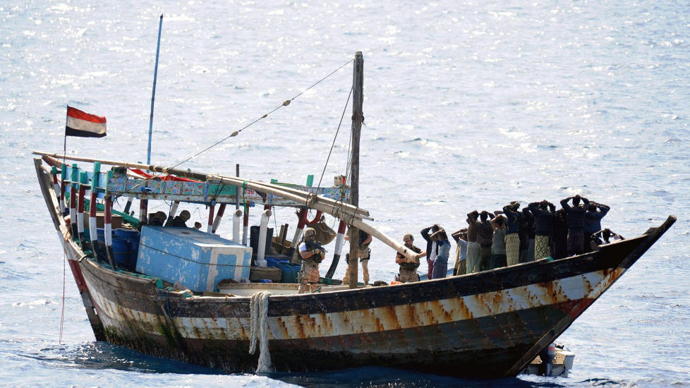 PROBLEM FOR SKIPSFARTEN: Dette somaliske skipet ble bordet av britiske marinesoldater i Det indiske hav 10. februar, og piratene tvunget til � l�slate fem gisler. � henrette pirater eller senke skipene deres er ingen l�sning, mener kronikkforfatteren. 

Foto: AP/Scanpix