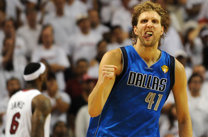 Dirk Nowitzki of the Dallas Mavericks celebrates a point against the Miami Heat in Game 6 of  the NBA Finals on June 12, 2011 at the AmericanAirlines Arena in Miami, Florida.  Jason Terry scored 27 points and Nowitzki finished with 21 points and 11 rebounds as the Mavericks won 105-95 to take the best-of-seven championship series four-games-to-two to claim their first NBA championship in franchise history. AFP PHOTO / Don EMMERT