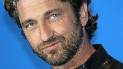 HOLLYWOODHUNK: Filmstjernen Gerard Butler gjester fyrstebryllupet. Foto: Valery Hache/AFP Photo/Stella Pictures