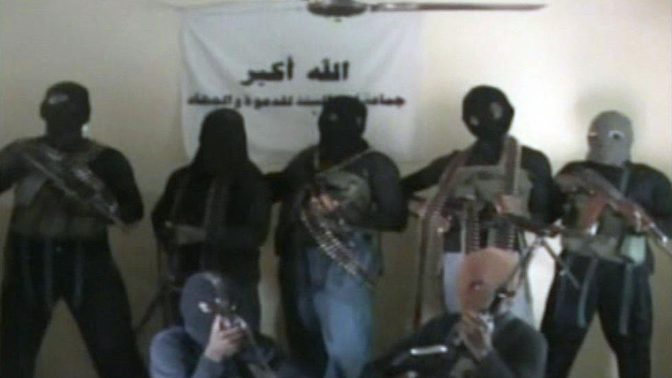 RESTRICTED TO EDITORIAL USE - NO MARKETING NO ADVERTISING CAMPAIGNS - DISTRIBUTED AS A SERVICE TO CLIENTS
A screen grab made on October 21, 2010 in Kano from a video allegedly released by the Nigerian Islamist sect Boko Haram in northern Nigeria reportedly shows shows seven alleged sect members standing in an undisclosed location. Boko Haram 'spokesman' claims responsibility for the attack on the UN building in Abuja that killed 18 on August 26, 2011. A suicide bomb blast rocked the UN compound in the Nigerian capital Abuja on Friday, killing at least 18 people, blowing out much of the building and marking a sharp escalation in a wave of attacks. AFP PHOTO