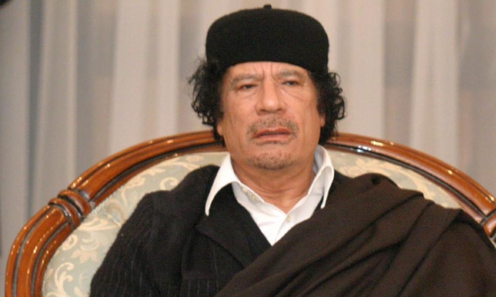 epa00891325 Libyan leader Muammar Gadaffi gestures as he talks about African affairs during the signing of a treaty of  reconciliation between Chad and Libya in Tripoli on Sunday 24 December 2006.  EPA/SABRI ELMHEDWI
