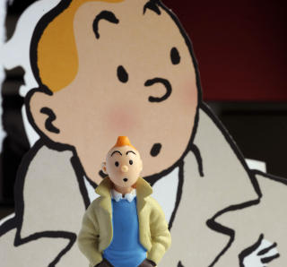 SERIEFIGUR: Legendariske Tintin i to varianter. Foto: JEAN PIERRE MULLER/AFP PHOTO