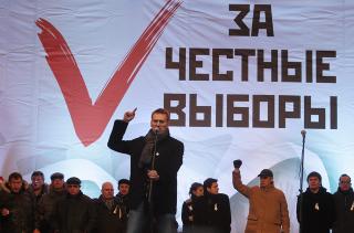 REDELIG VALG: St�r det bak de mange talerne som motiverte folkemassen under demonstrasjonen i dag. Foto: Sergei Chirikov / EPA
