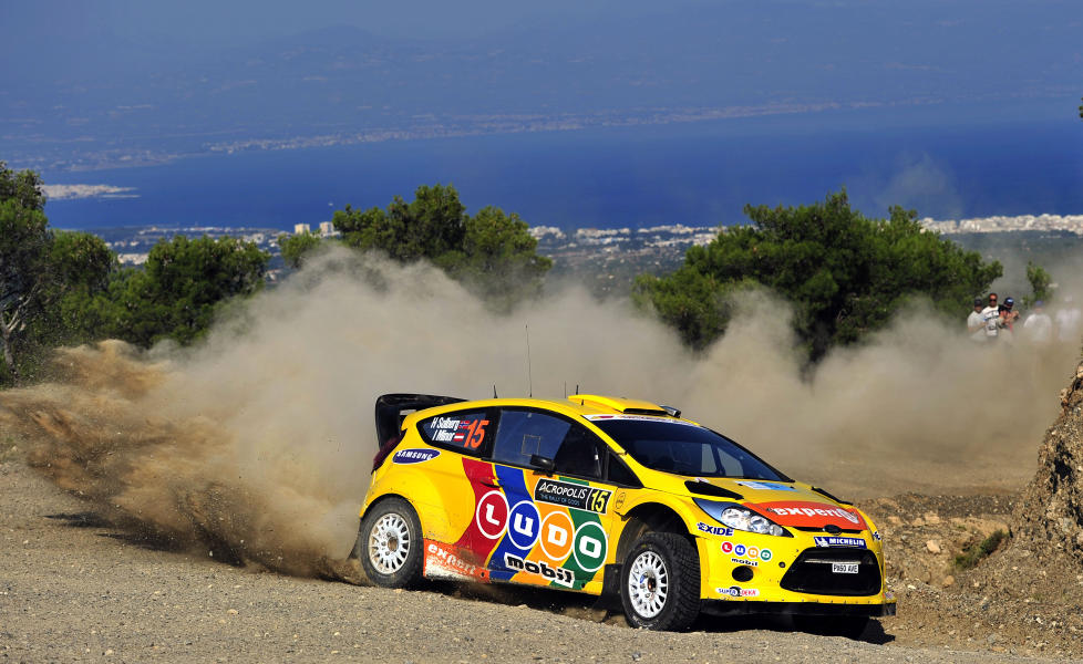 STILLER I SVERIGE: Henning Solberg stiller p� start i Rally Sverige, men resten av VM-satsingen er stadig i det bl�.Foto: SCANPIX / AFP PHOTO / Aris Messinis