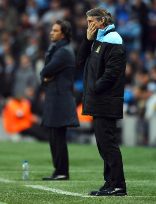VIDERE: Manchester City og manager Roberto Mancini. Foto: AFP PHOTO/PAUL ELLIS