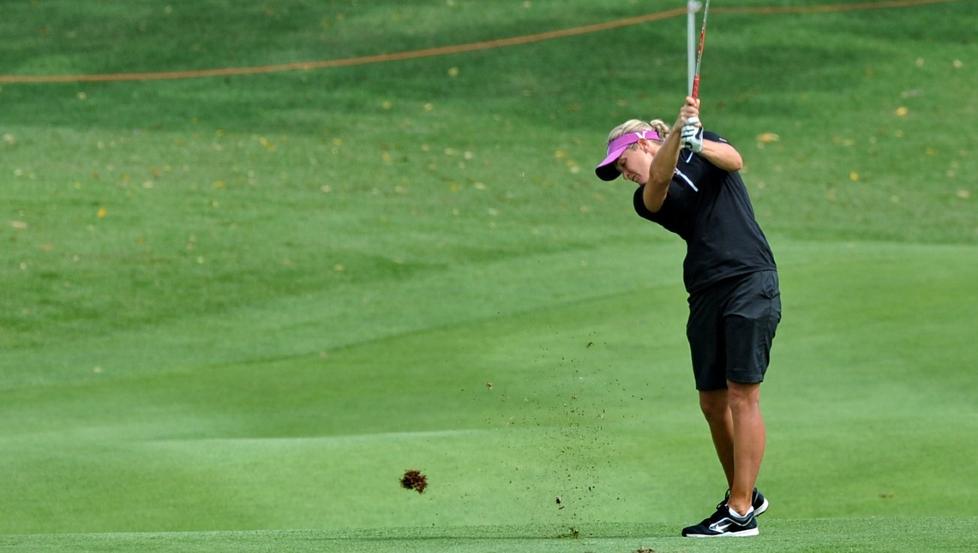 Norway's Suzann Pettersen takes a shot along the fairway during round one of the HSBC Women's Champions golf tournament in Singapore on February 23, 2012. AFP PHOTO / ROSLAN RAHMAN