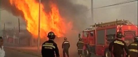 Flammene herjer med Chile