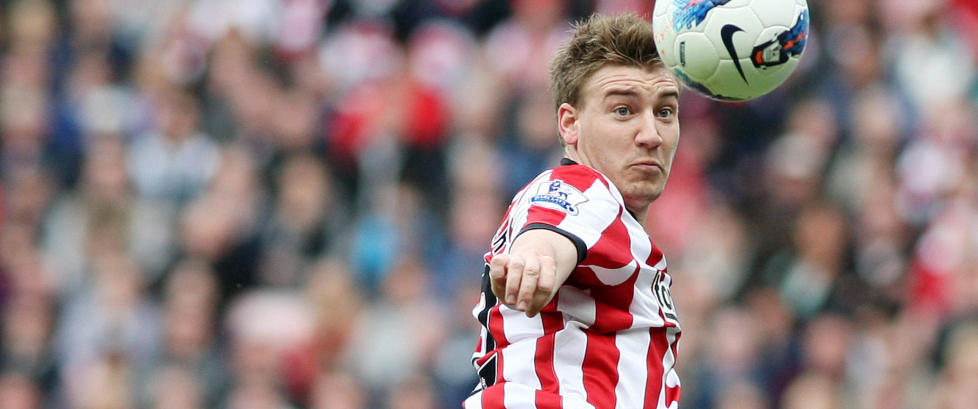 Bendtner ble vraket til United-kampen fordi han mistet bussen