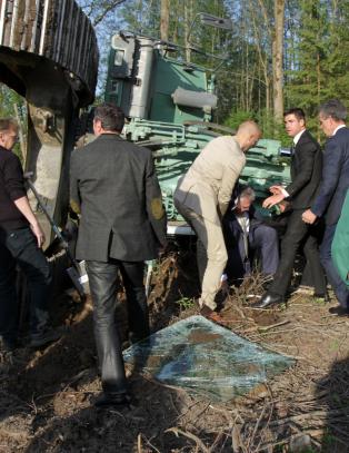 Tysk minister veltet gravemaskin