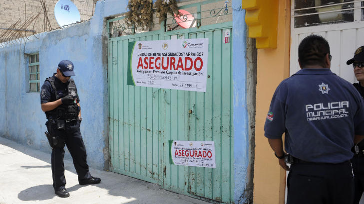 HUSET: Politiet har forseglet huset der gutten ble funnet. Foto: REUTERS/Alejandro Dias/NTBScanpix HUSET: Politiet har forseglet huset der gutten ble funnet. Foto: REUTERS/Alejandro Dias/NTBScanpix