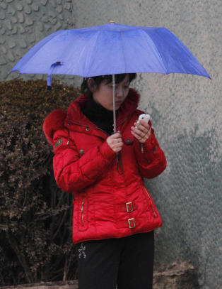 Nord-Korea g�r inn i en ny �ra - tillater deg � ta med mobiltelefon inn i landet