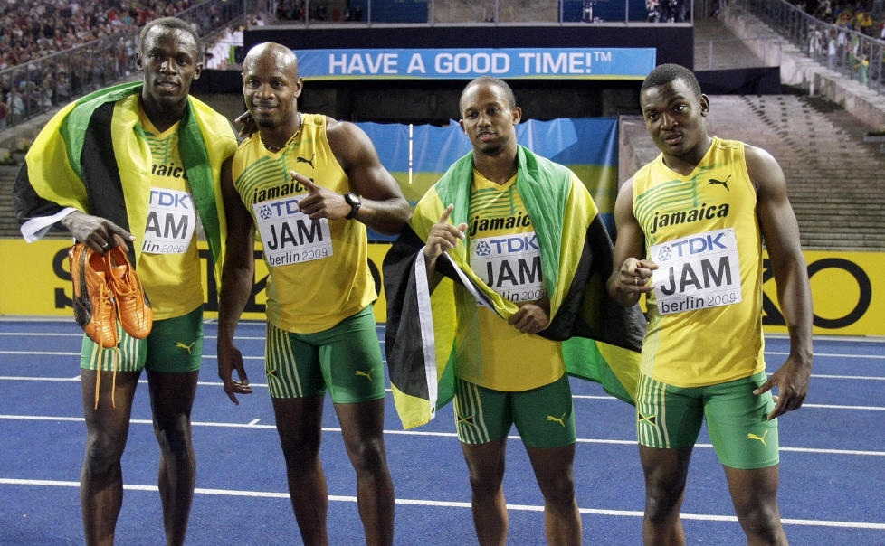 TOK VM-GULL: Usain Bolt, Asafa Powell, Michael Frater og Steve Mullings tok gull p� 4x100 meter stafett i Berlin-VM. Foto: AP Photo/Matt Dunham/NTB scanpix