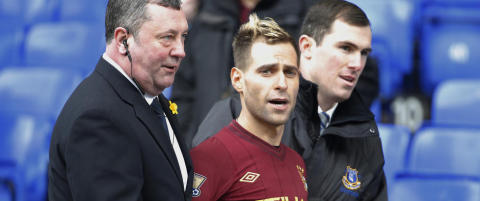 Her fors�ker City-supporter
� varme opp med laget