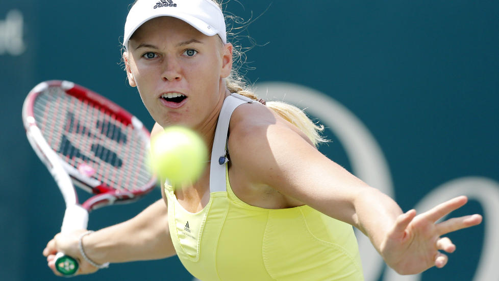 UTE I F�RSTE RUNDE: Caroline Wozniacki m�tte gi tapt for 23.-seedede Carla Suarez Navarro. Foto: AP Photo/Mic Smith/NTB scanpix