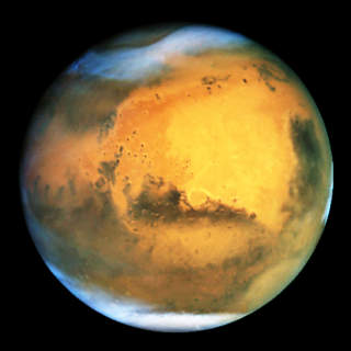 G�TEFULL NABO: Mars, jordas ytre nabo i solsystemet, har i uminnelige tider v�rt gjenstand for fascinasjon. Foto: NASAS �HUBBLE�-TELESKOP/AP/SCANPIX