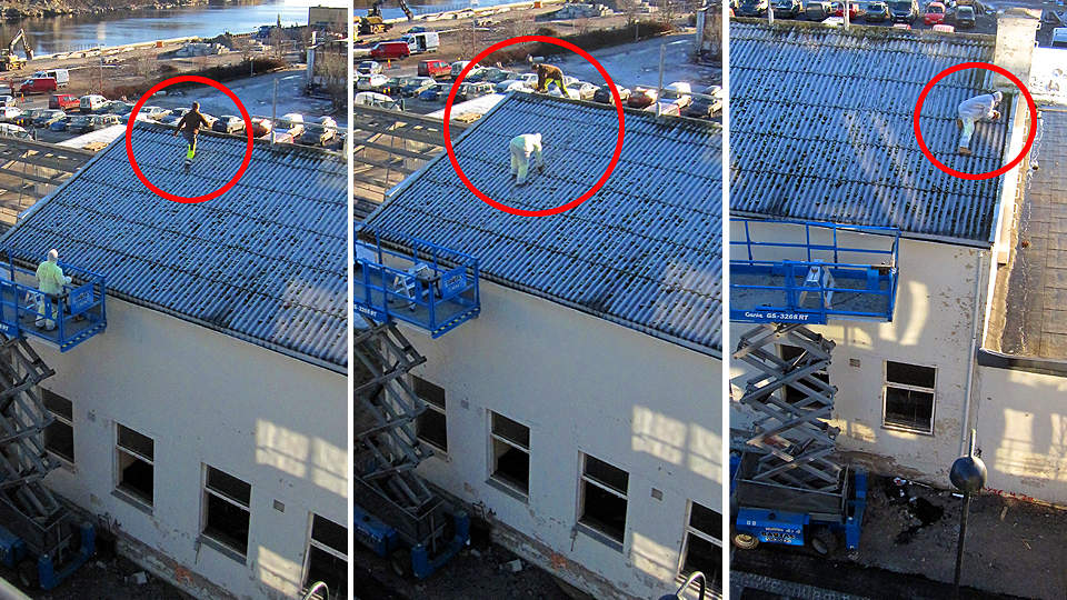 LIVSFARLIG: Helt uten noen form for sikring, ligger s�nnen til eieren av rivefirmaet p�
kn�rne p� det s�peglatte taket og strever med � l�sne en skrue. Han er i
livsfare og ville ha deiset rett i bakken 10-12 meter under dersom han
hadde mistet fotfestet. Den glatte plastdrakta hadde gitt ham ekstra fart
nedover taket.
Foto: Eivind Pedersen
