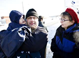 M� GJ�RE NOE N�: Det m� handles straks, mener David DeLambo. Her sammen med kona Mary Pat og s�nnen Tommy. Alle tre jobbet de som frivillige for Obama under valgkampen. Foto: SVEINUNG UDDU YSTAD
