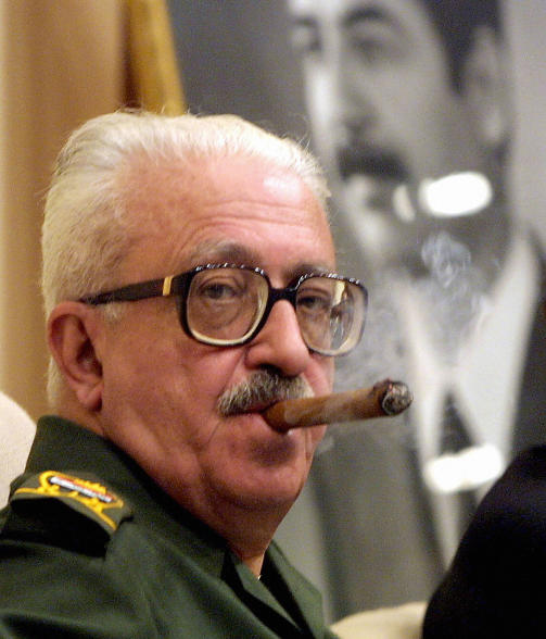 GJERNE MED EN SIGAR:   Tariq Aziz er gjerne avbildet dampende p� en sigar. Her fra september 2002.Foto: SCANPIX/AFP PHOTO/Karim SAHIB