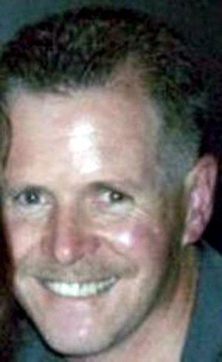 DREPT: Politimannen Stephen Paul Carroll (48). Foto: EPA/PSNI/Scanpix