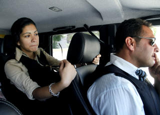 Tungt beskyttet: Ayesha og alle andre p� den norske ambassaden er tvunget til � ta p� seg skuddsikker vest n�r de beveger seg utenfor ambassaden. Transporten er alltid med pansrede biler.