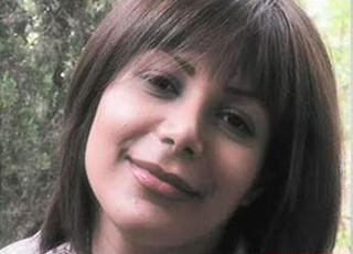 MARTYREN: Bildene av den d�ende Neda Agha-Soltan har g�tt verden rundt. Hun har n�rmest f�tt martyrstatus og blitt et symbol p� myndighetenes brutalitet under valgbr�ket. Foto: AFP/SCANPIX