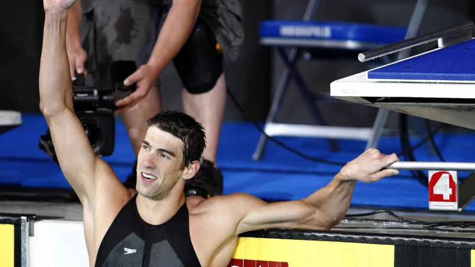 STOLT: Her jubler Michael Phelps over ny bestetid p� 100 meter butterfly. Foto: REUTERS/Christinne Muschi