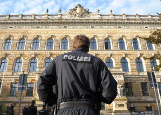 epa01910799 German police stand guard outside the District Court in Dresden, Germany, 26 October 2009 for the trial of Alex W., a 29-year-old German national of Russian descent, accused of murdering pregnant Egyptian Marwa El Sherbiny in a courtroom in Dresden earlier in the year. The trial start was delayed more than half an hour due to sharply stepped-up security precautions. The Egyptian victim Marwa El Sherbiny was stabbed to death by the defendant in the same courtroom in Dresden, Germany on 01 July 2009 shortly before she was to give evidence in an appeal lodged by the man against a 330 euro (480 US dollar) fine he was ordered to pay for verbally abusing the woman at a children's playground in August 2008.  EPA/RALF HIRSCHBERGER