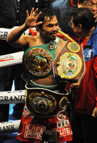 VERDENS BESTE: Manny Pacquiao anses � v�re verdens beste bokser, uansett vektklasse. Seieren i natt ble bel�nnet med hans sjuende VM-tittel i like mange vektklasser. Foto: Scanpix