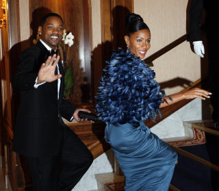 NYDELIG I BL�TT:  Jada Pinkett Smith og ektemannen Will kom en halvtime for seint, men var ulastelig antrukket da de endelig kom seg inn p� Grand. Foto: Lise �serud / Scanpix POOL