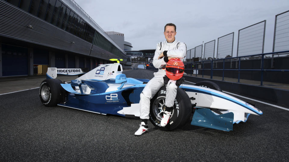 TILBAKE ETTER FIRE �R: Michael Schumacher viser fram sin nye bil under testkj�ring. Foto: REUTERS/Malcolm Griffitths