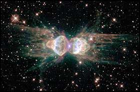 STOR MAUR: Dette er de gl�dende restene av en d�ende sol-likende stjerne. Siden den likner en maur, er den d�pt �ant nebula�. Fra teleskop p� jorda har forskerne bare sett �maurens� hode og bryst, men ved hjelp av Hubble-teleskopet ble det tatt bilder av kroppen ogs�.