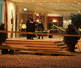 Police outside Radisson hotel in Amman. AP.