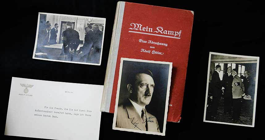 OMSTRIDT: En signert f�rsteutgave av �Mein Kampf� ble solgt p� auksjon i 2005. Med boka fulgte signerte foto av nazilederen sammen med den britiske statsministeren Neville Chamberlin og andre nazidokumenter. I 2015 g�r opphavsretten p� boka ut.